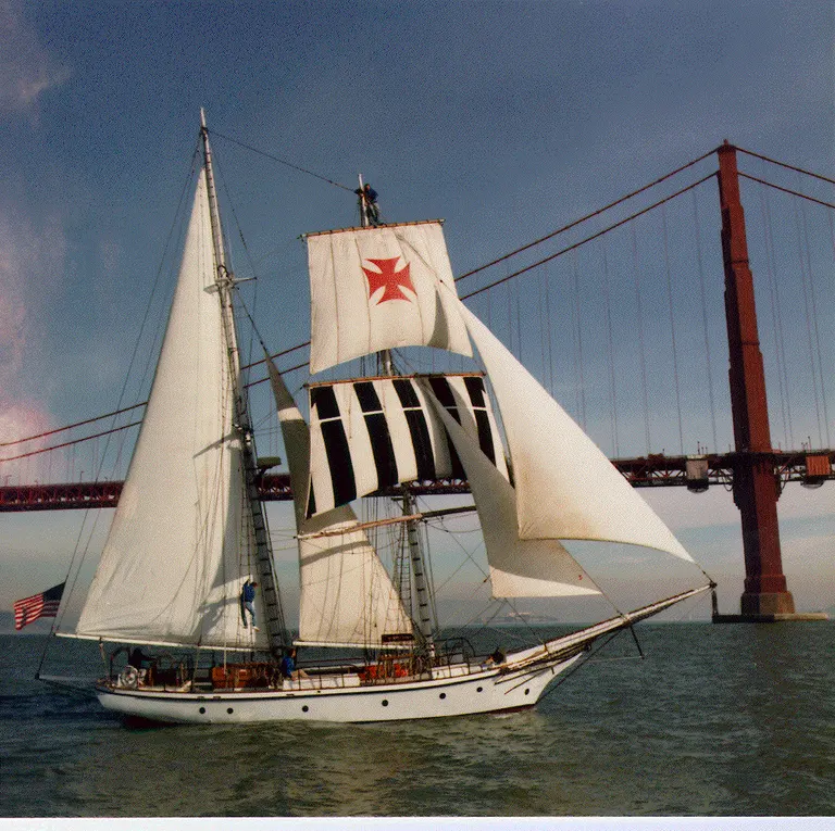 The 78-foot brigantine Rendezvous under sail beneath the Golden Gate Bridge